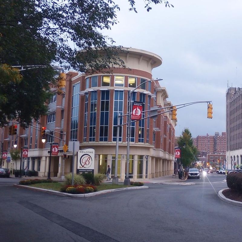 View of Bloomfield College with street traffic in downtown Bloomfield