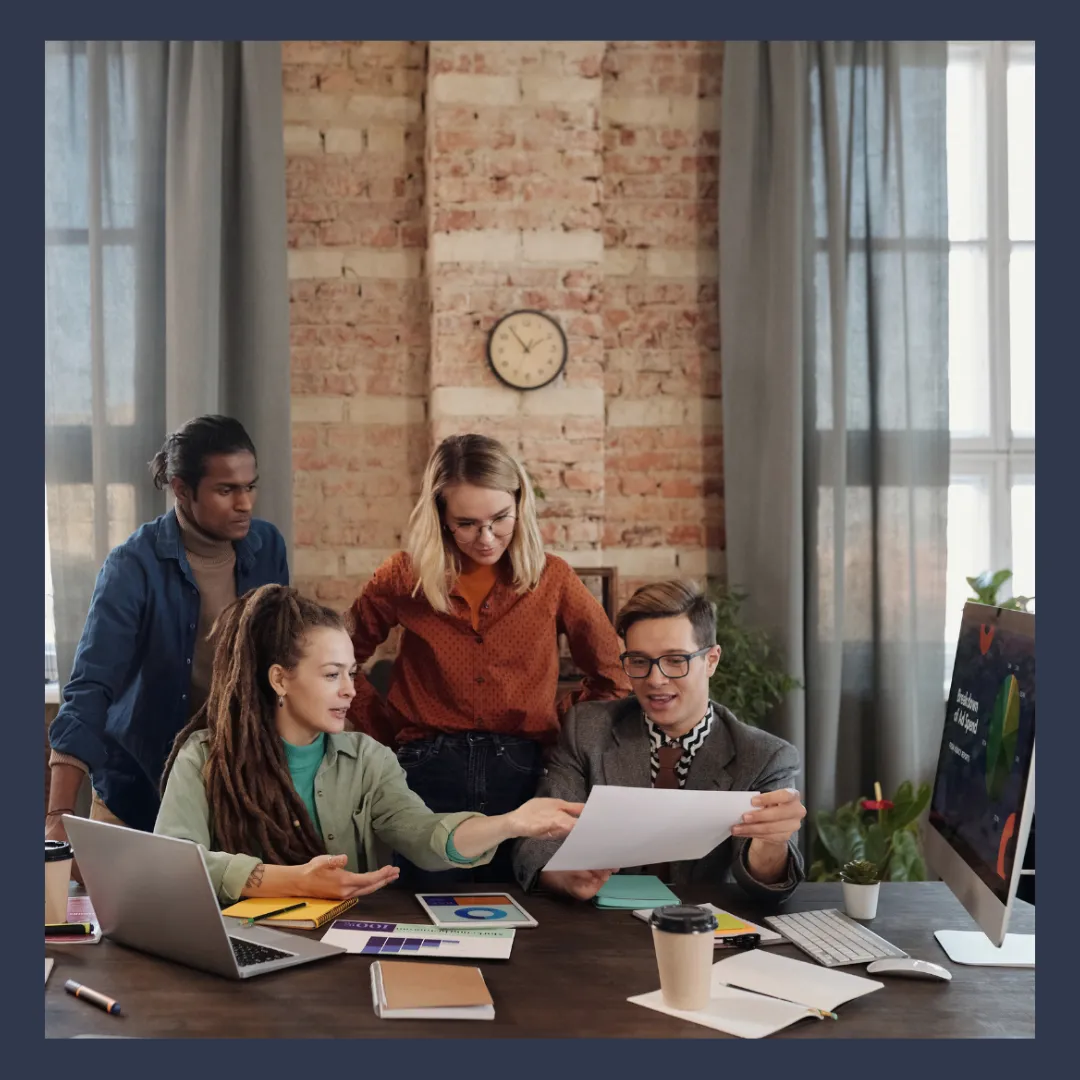 A diverse group of business owners from different industries standing together or engaging in a meeting. 