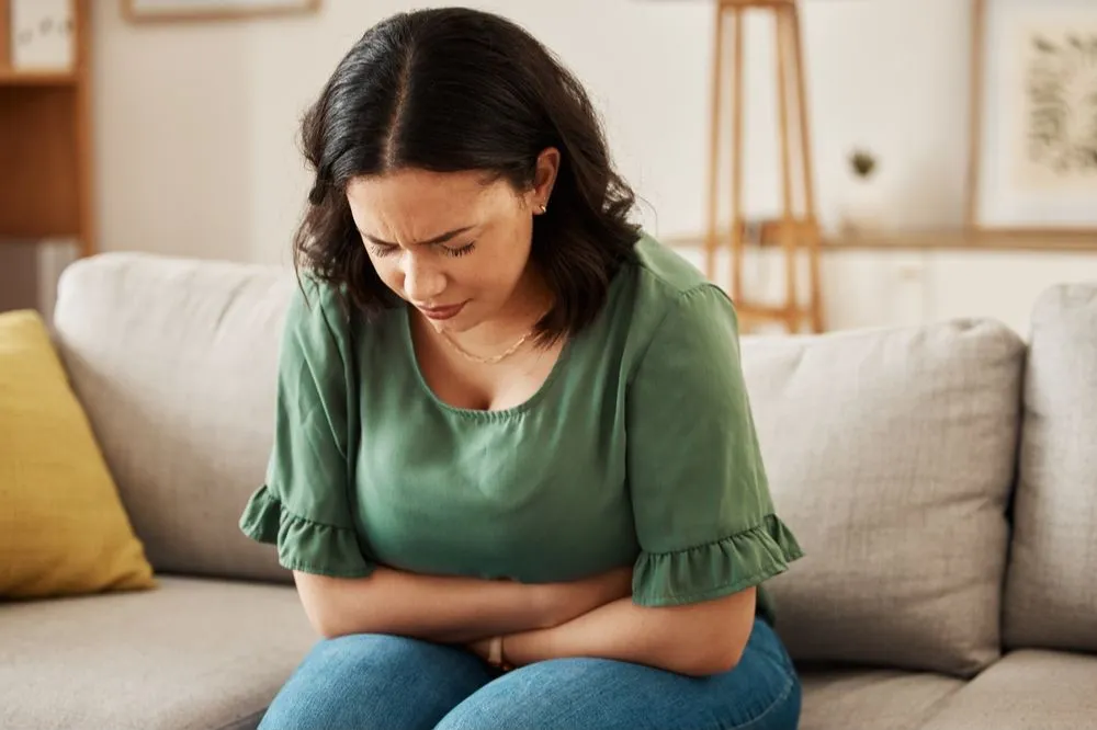 Woman experiencing gut discomfort