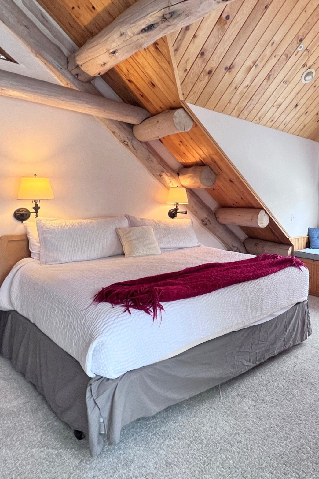 woman setting sheets on bed