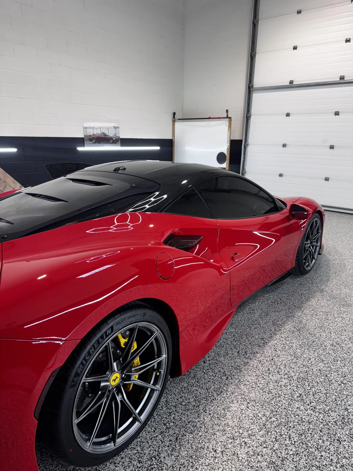 Exhaustive quality control inspection of vehicle wrap under bright studio lighting