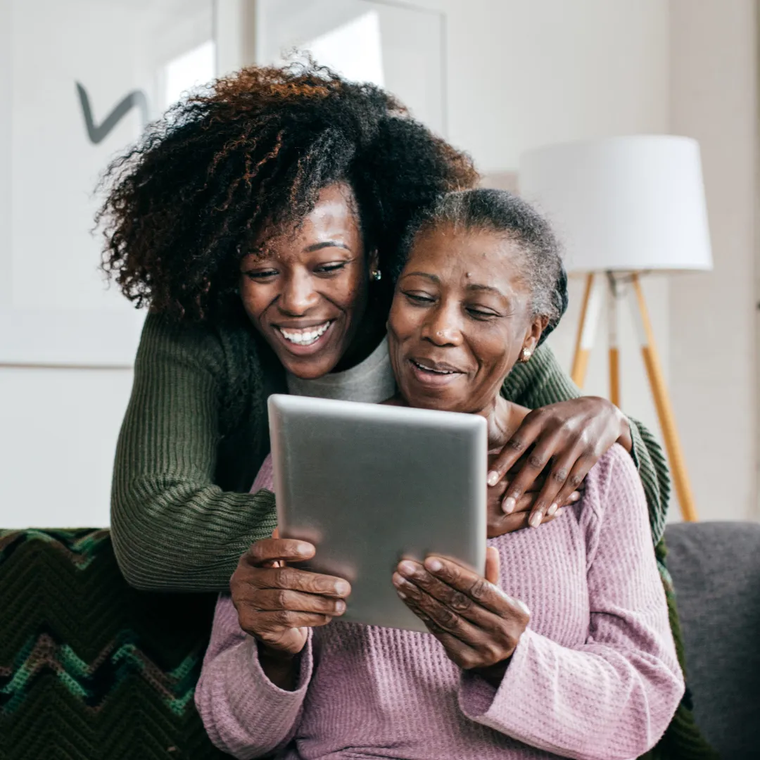 black, brown, and white bird standing on person right hand