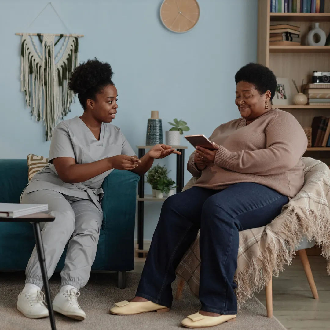 black, brown, and white bird standing on person right hand