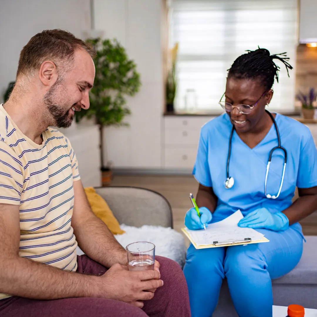 black, brown, and white bird standing on person right hand