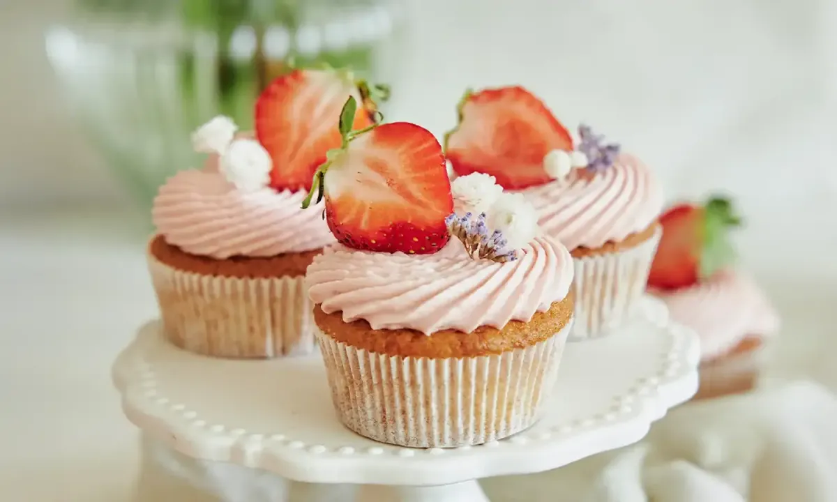 Assorted handcrafted cupcakes with vibrant frosting and artistic toppings