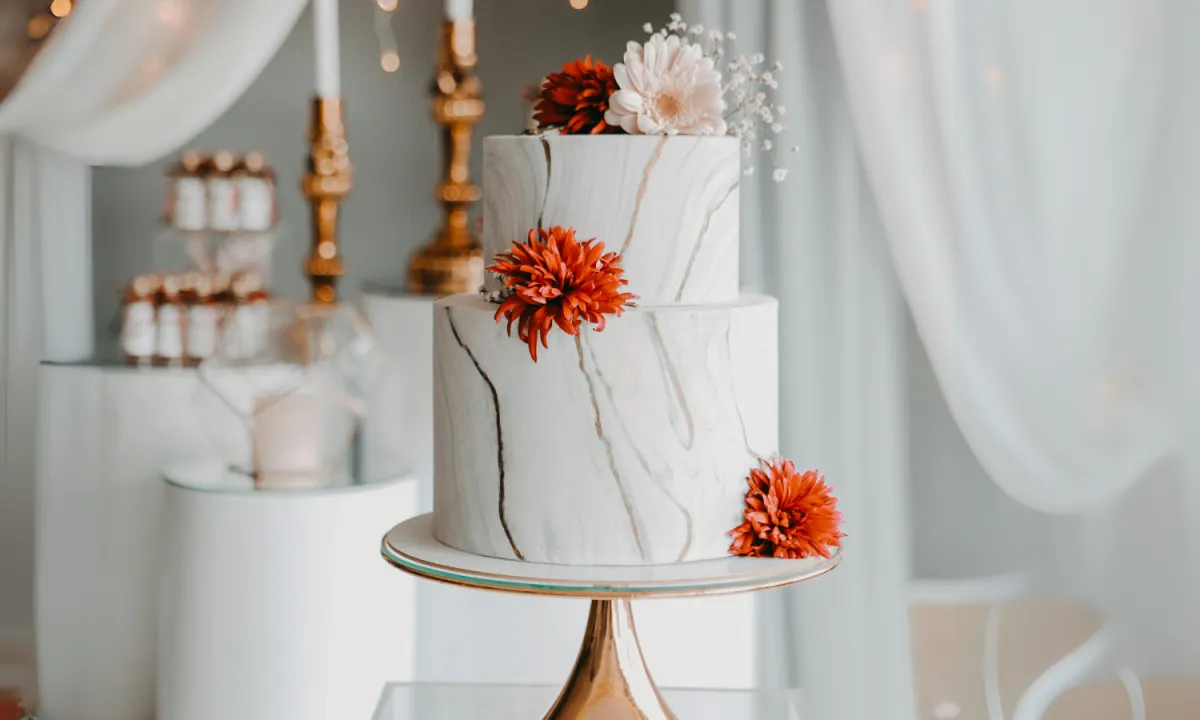 Elegant anniversary cake with a layered design, delicate frosting, and subtle floral accents
