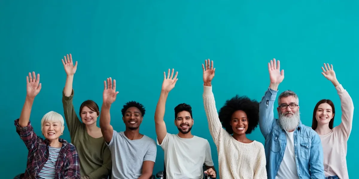 Row of diverse people with hands raise, symbolizing participation, inclusion, and enthusiasm.