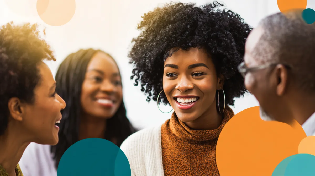 Diverse adults smiling and connecting in a warm group conversation, symbolizing community, support, and authentic belonging.