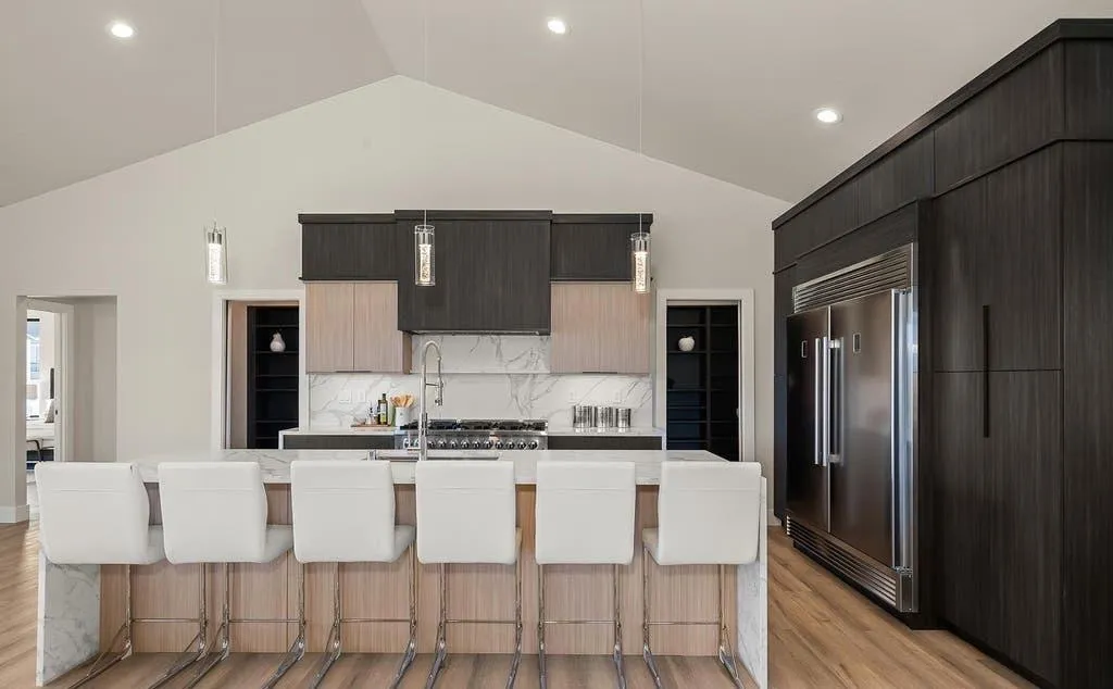 Custom kitchen remodel with quartzite waterfall island and exposed wood beams in San Diego