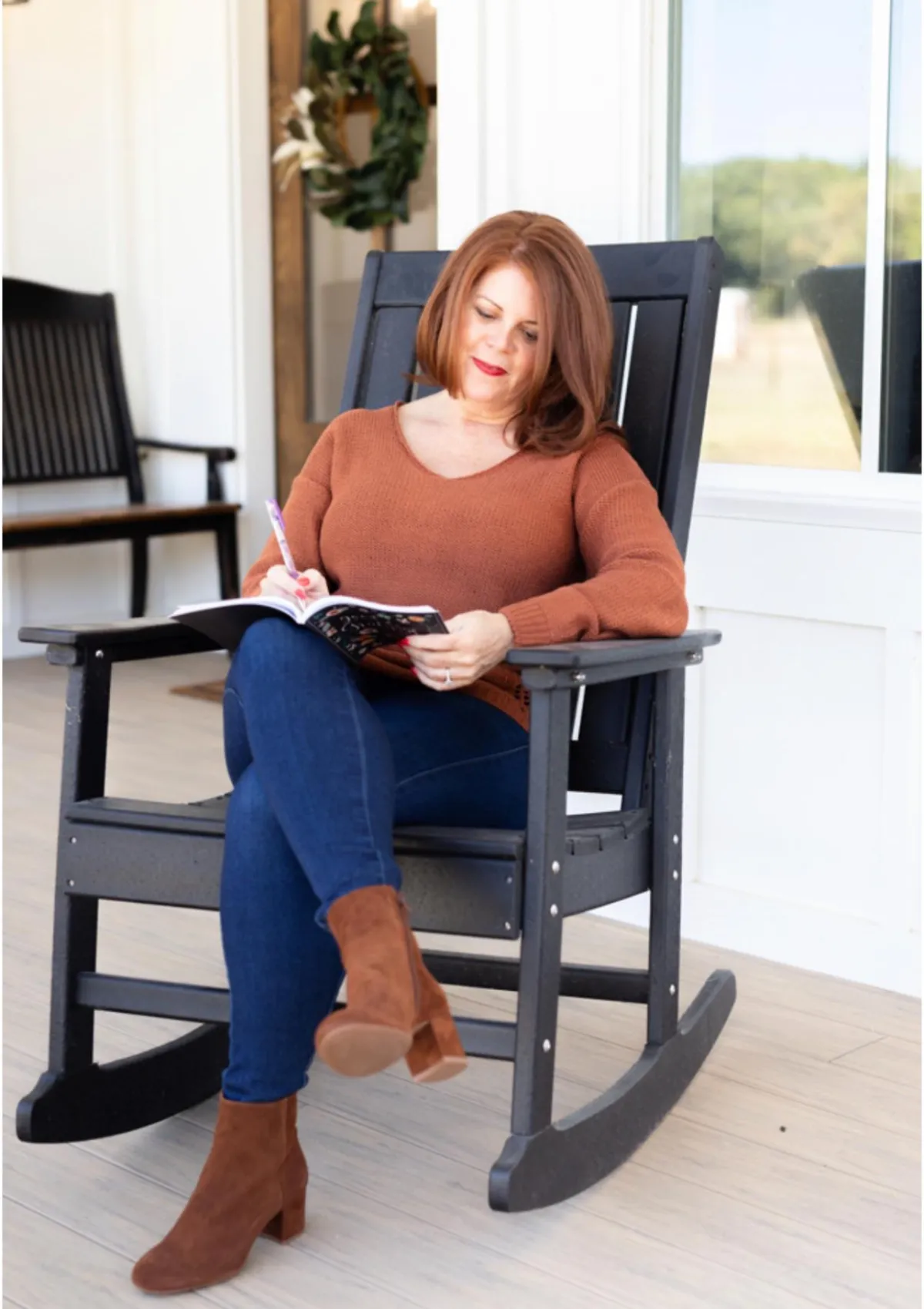 Stephanie Quade of Bliss Coaching for Women sitting on steps