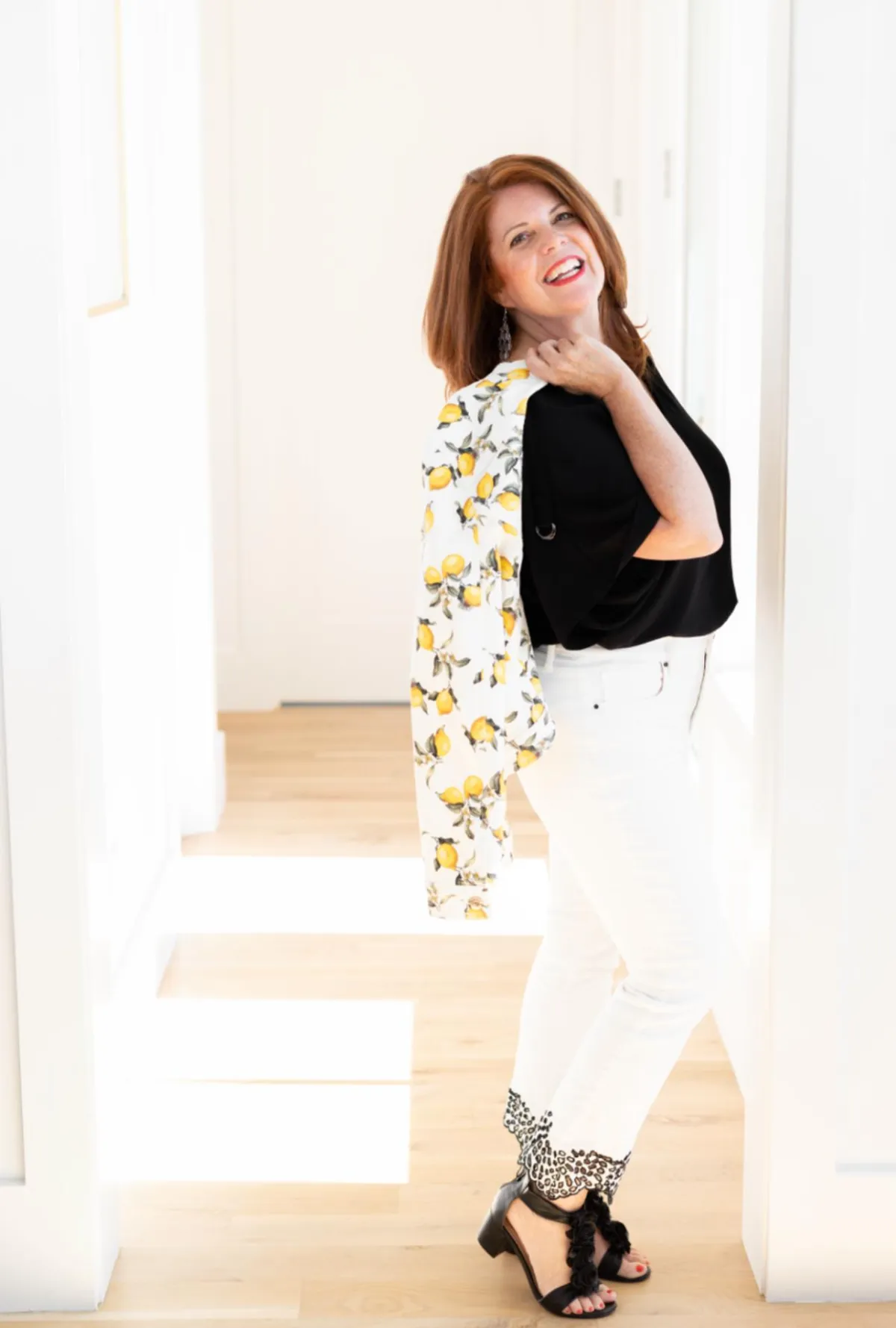 Stephanie Quade of Bliss Coaching for Women sitting on steps