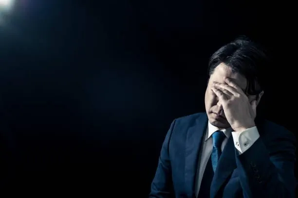 man in white dress shirt and pants statue