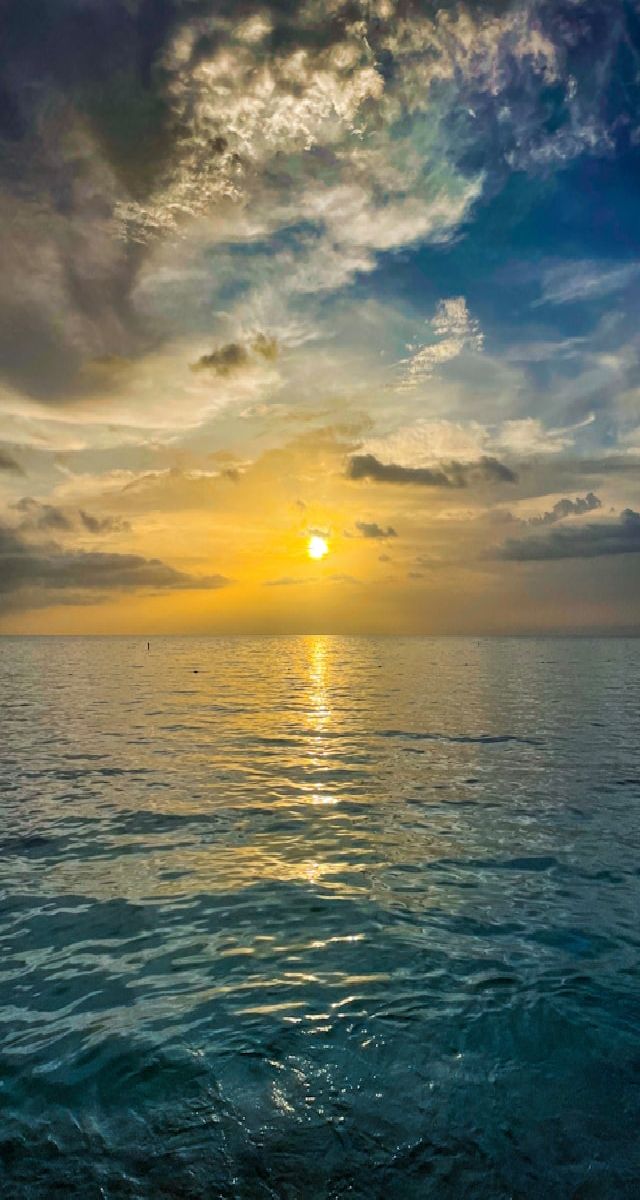 A yellow sunrise over the ocean