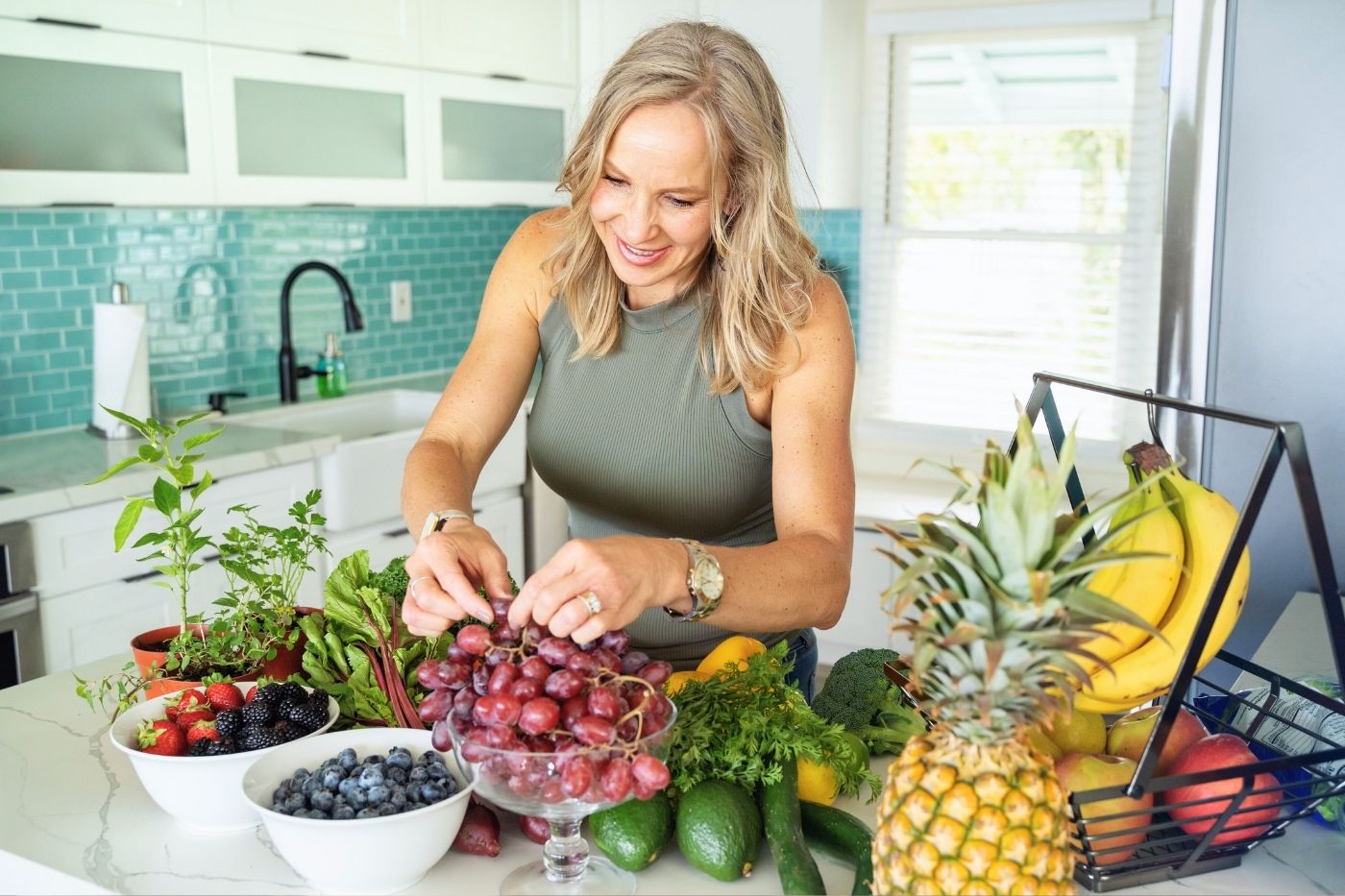 Health Practitioner in the Kitchen with Fresh Fruit