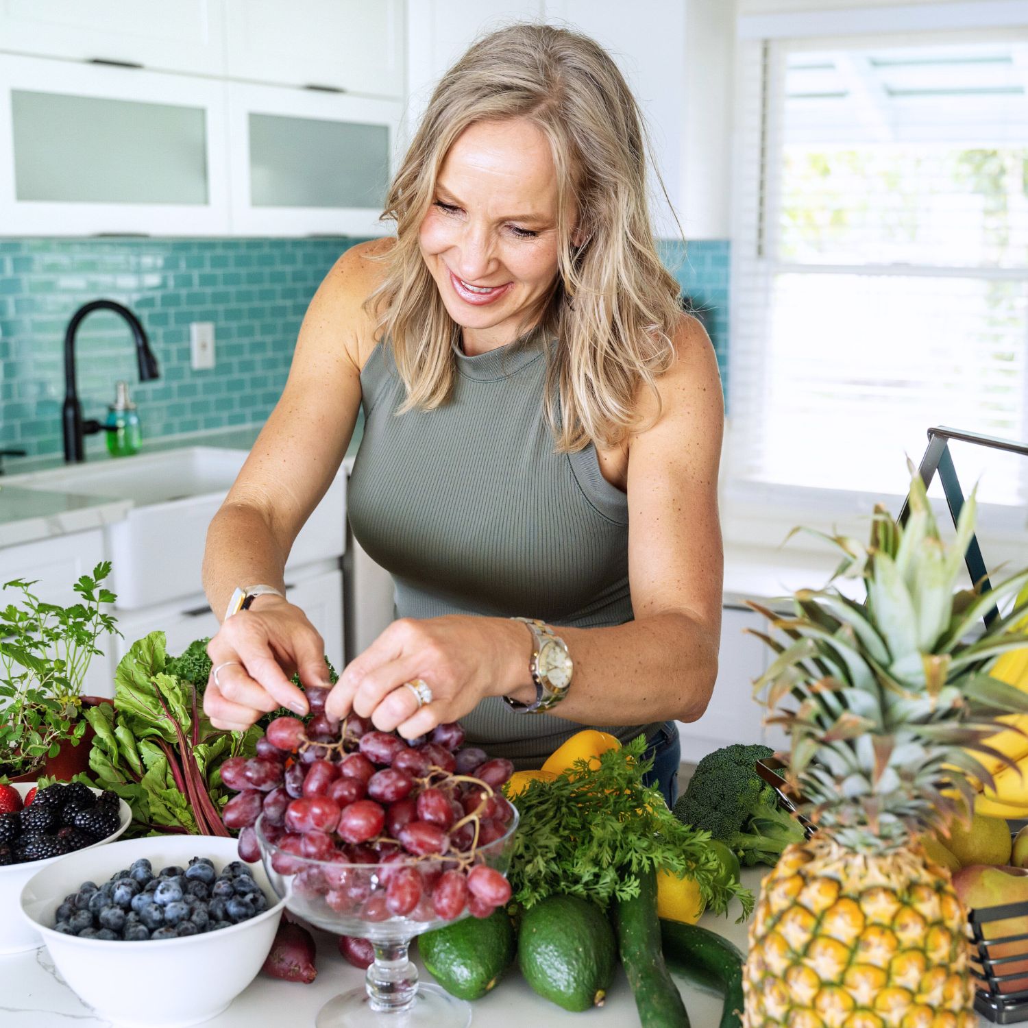 Integrative Health Practitioner in the Kitchen with Fresh Fruit