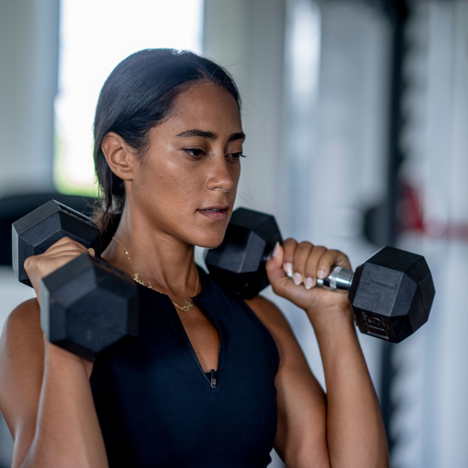 Woman Holding Weights to Help Reduce Biological Age