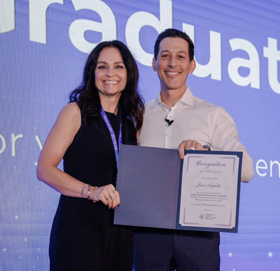 IHP Graduate on Stage with Dr. Cabral