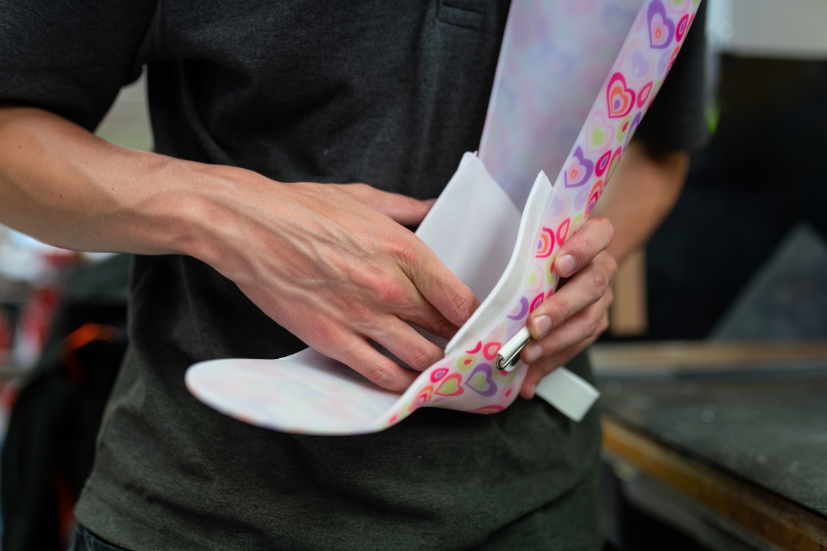orthotist prepares AFO for patient at their orthotic fitting appointment