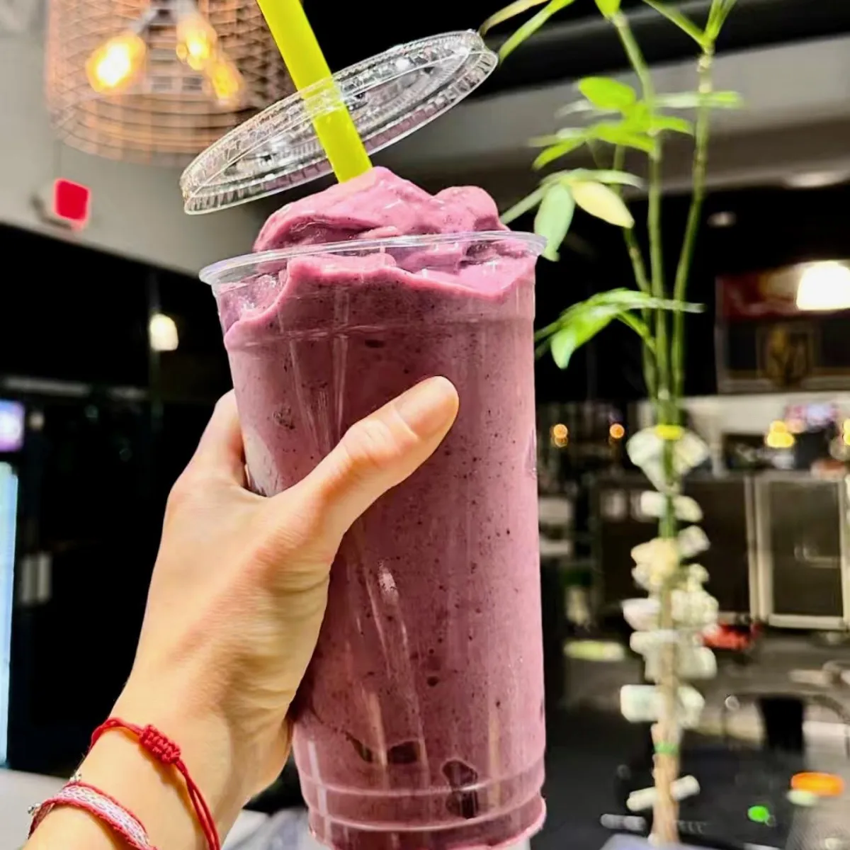 A man deadlifting 365 pounds on a deadlift platform.