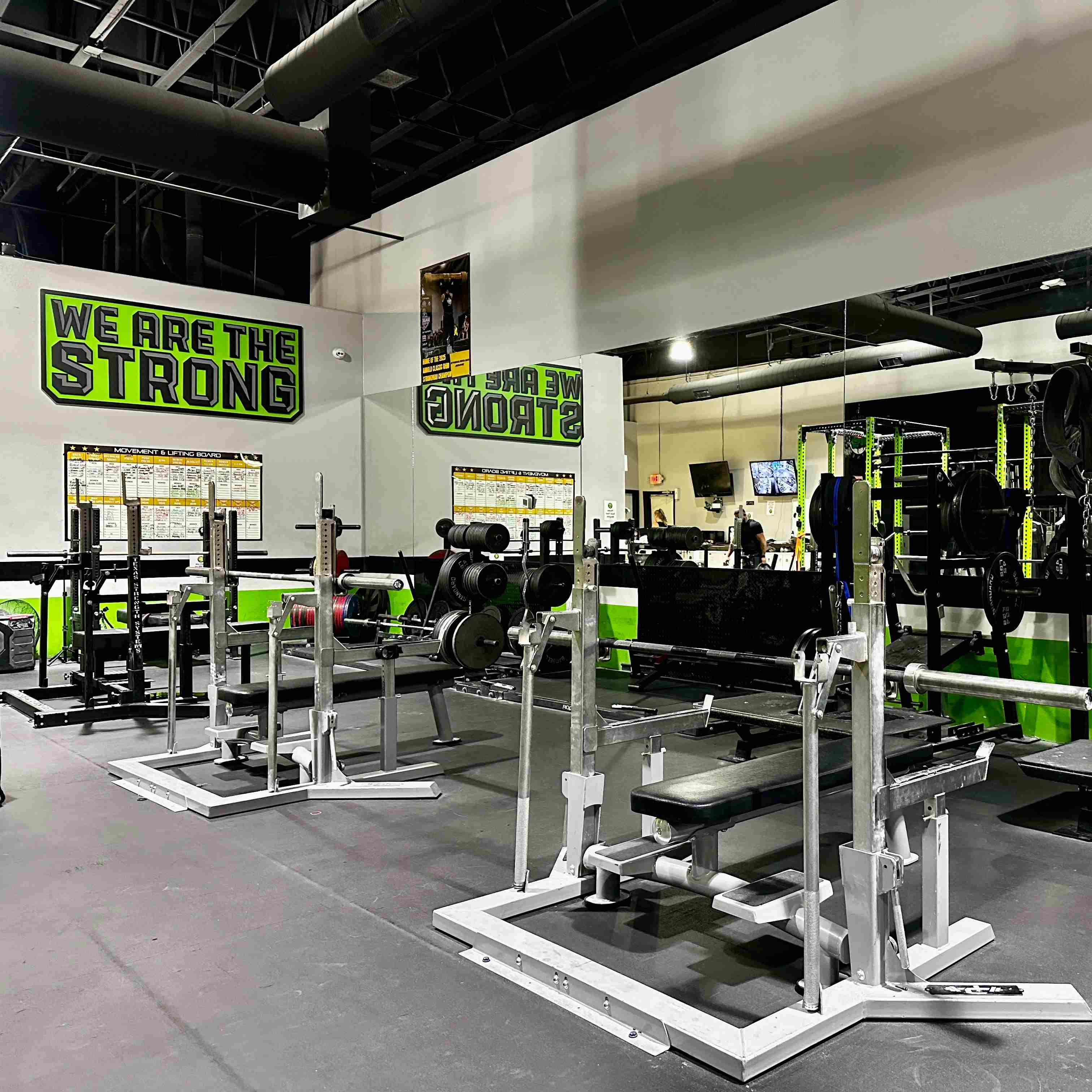 Competitive squat racks inside a local gym