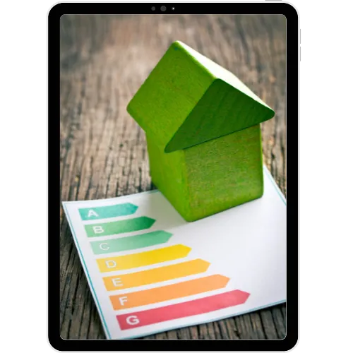 Tablet displaying energy rating chart with a green house model — highlighting Comerio Homes’ energy-efficient home features.