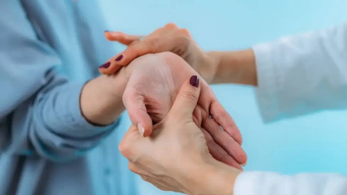 A chiropractor performing a non-invasive wrist adjustment for carpal tunnel relief in Fort Mill SC.