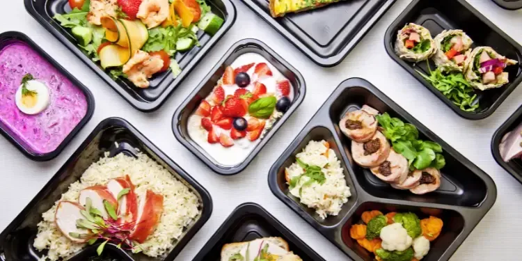 Anti-inflammatory healthy meal prep containers with lean proteins and fresh vegetables to support plantar fasciitis recovery and heel pain relief in Fort Mill, SC.
