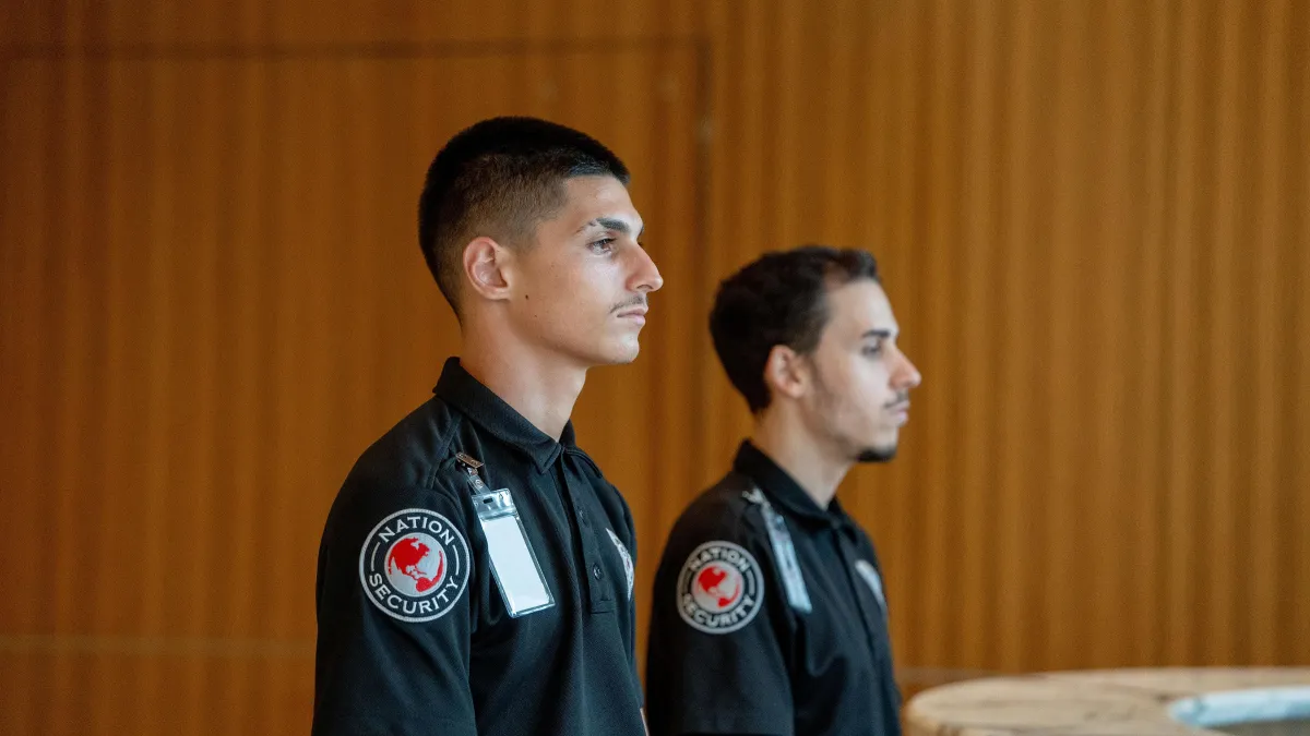 people sitting down near table with assorted laptop computers