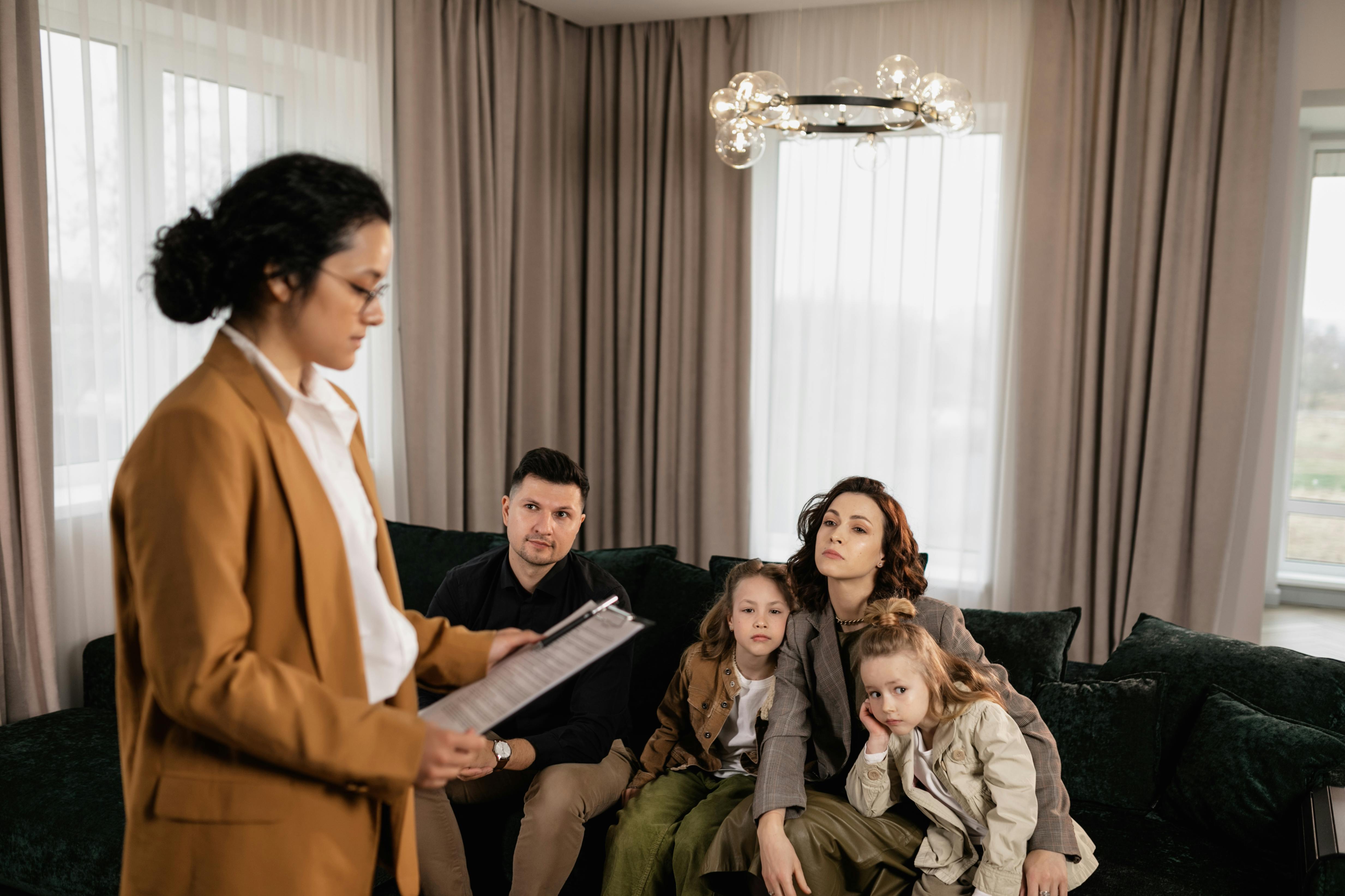 Latin American multigenerational family and real estate consultant reviewing documents