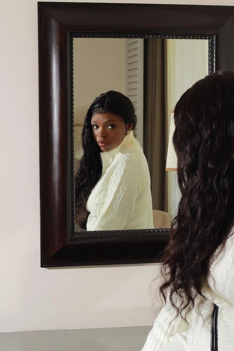 person wearing yellow hoodie near red Opel car