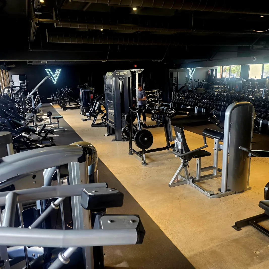 three person lifting barbels