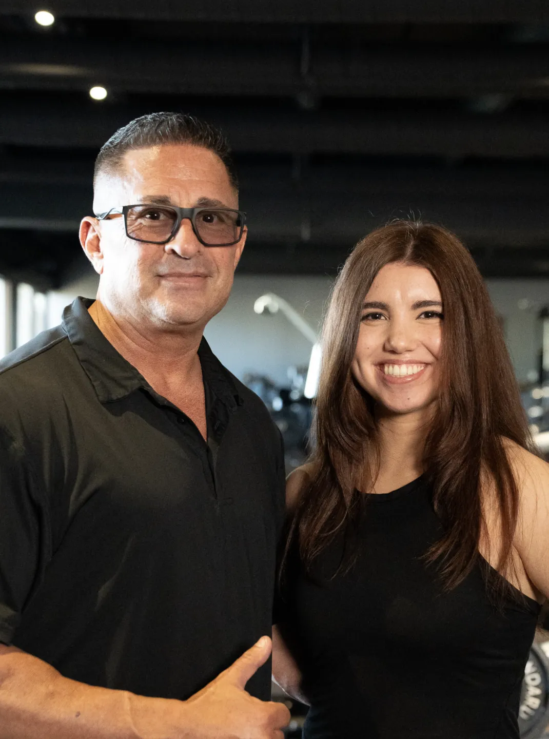 a young man working out with a barbell