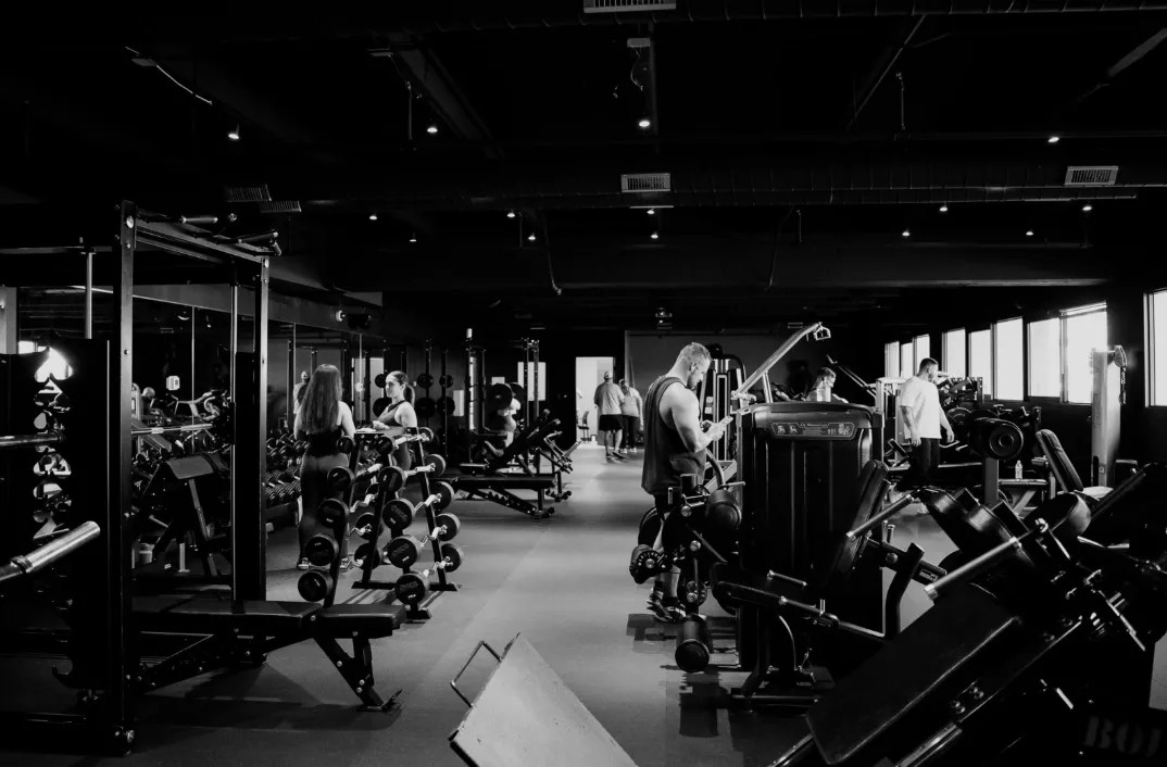 a pair of pink and black dumbs on a blue background