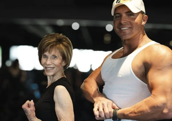 a pair of pink and black dumbs on a blue background