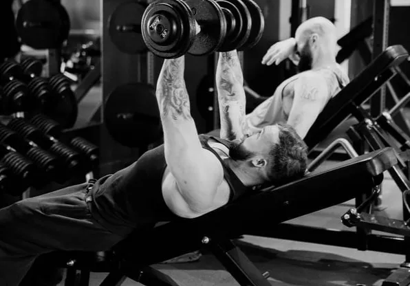 three person lifting barbels