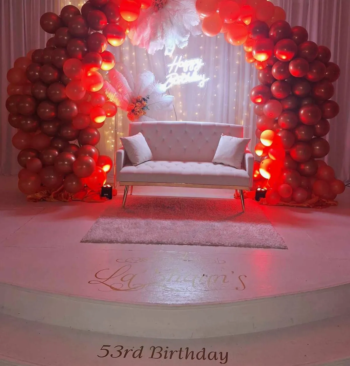 Rooftop table set up with a sign and scenery.