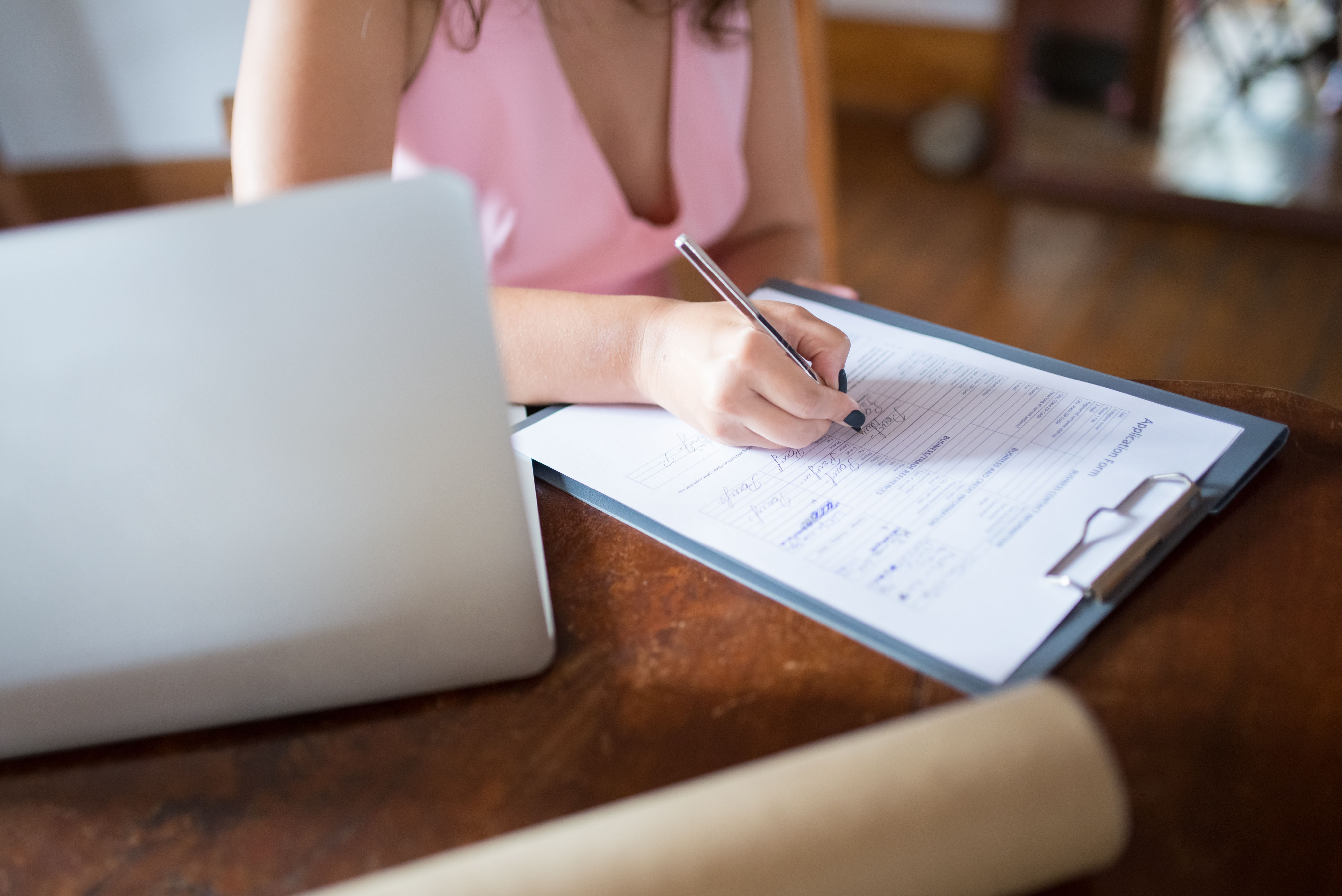 Client reviewing documents on tablet at home