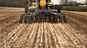 Pasture direct drilling machine working on West Coast dairy farm