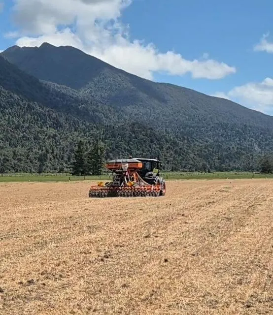 Direct drilling tractor operating on West Coast farm in Inchbonnie Moana