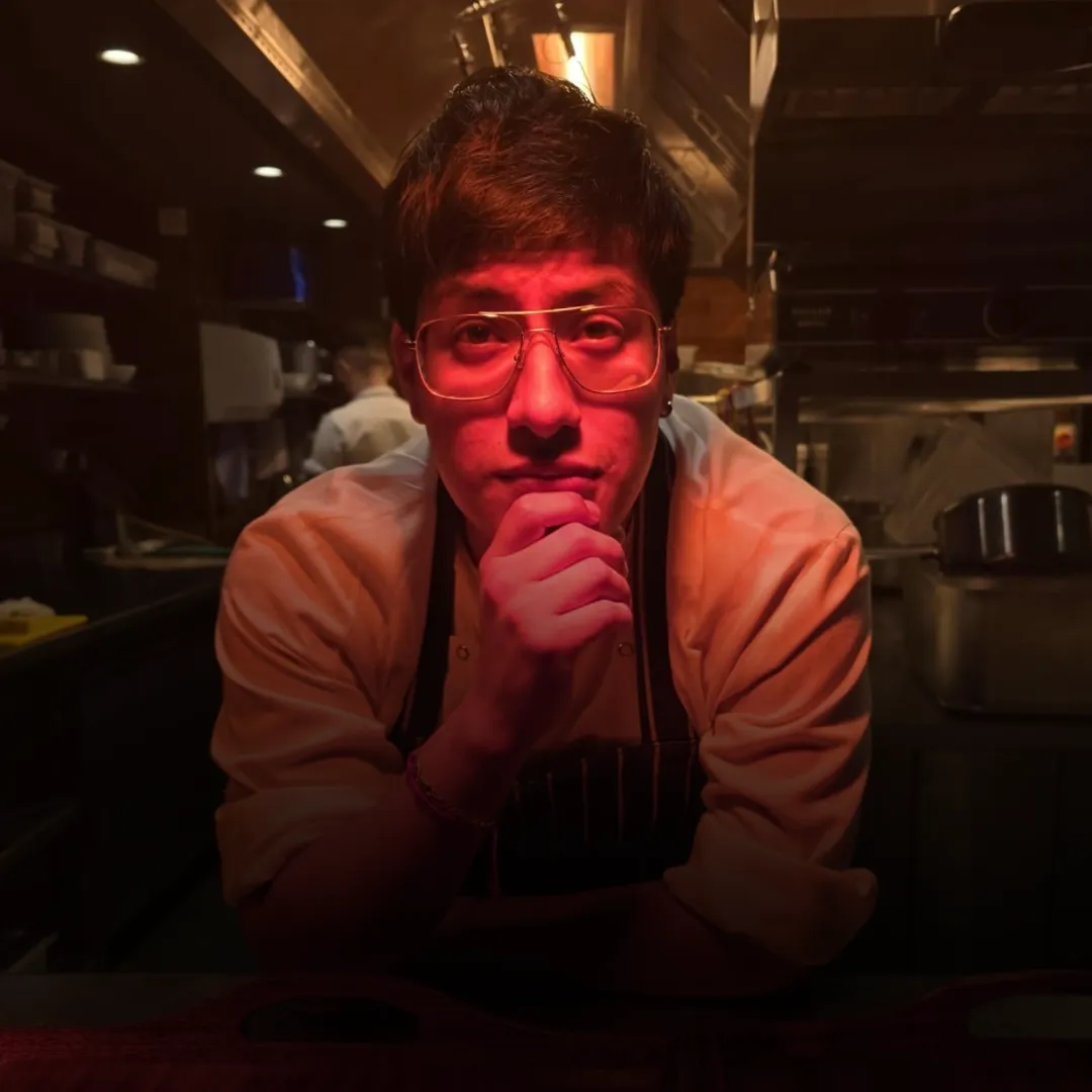 six white and brown eggs on white towel