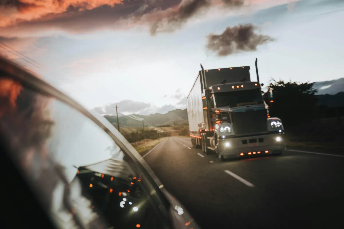 Black semi-truck on the highway for the DTRT Growth Engine
