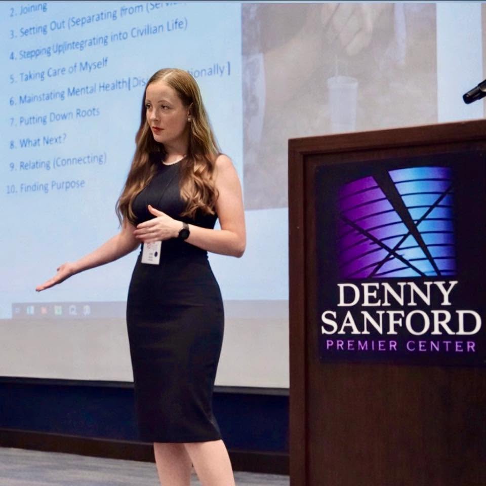 Jade Ronk speaking at a professional event