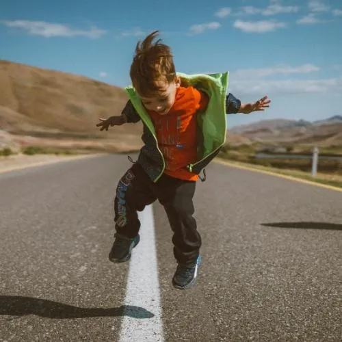 Kid jumping up and down