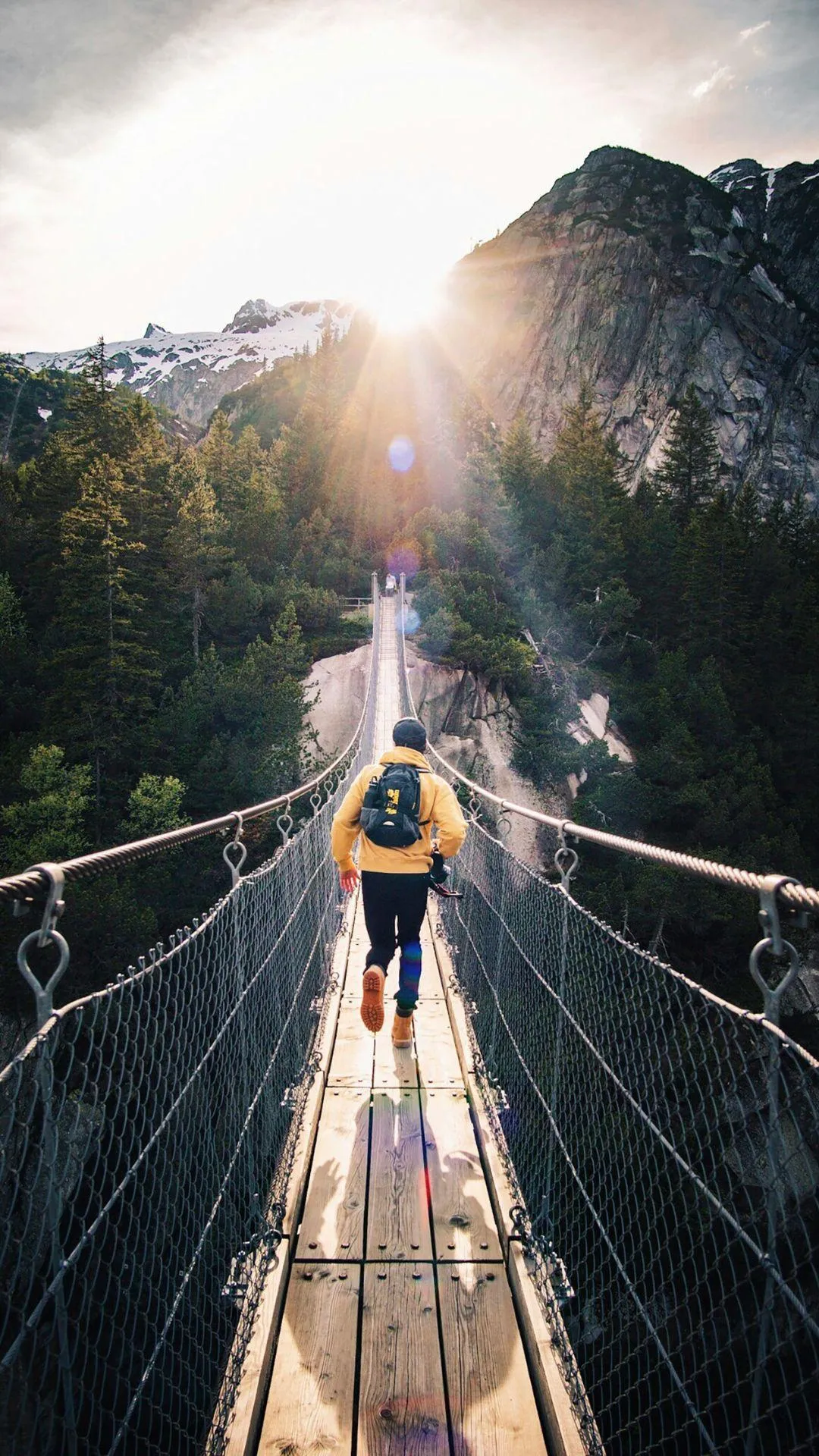 someone walking across a bridge