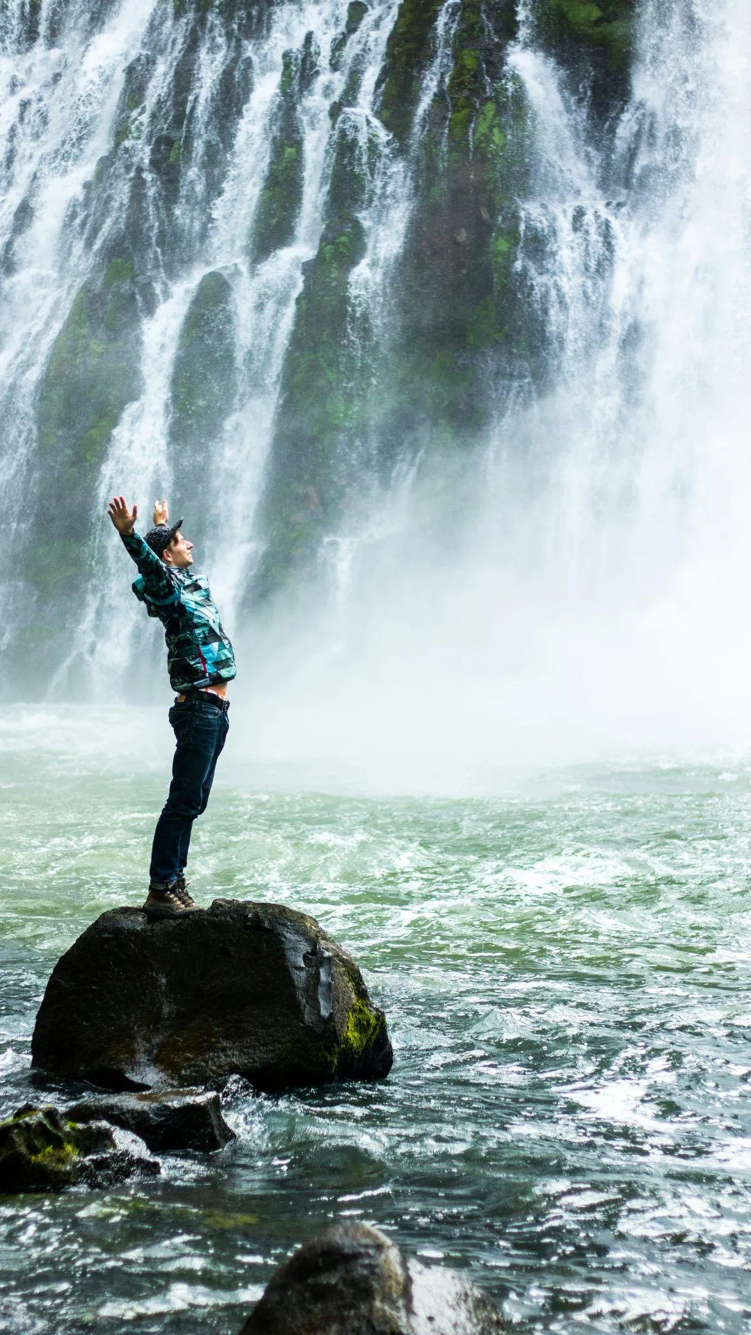 someone happy about a waterfall