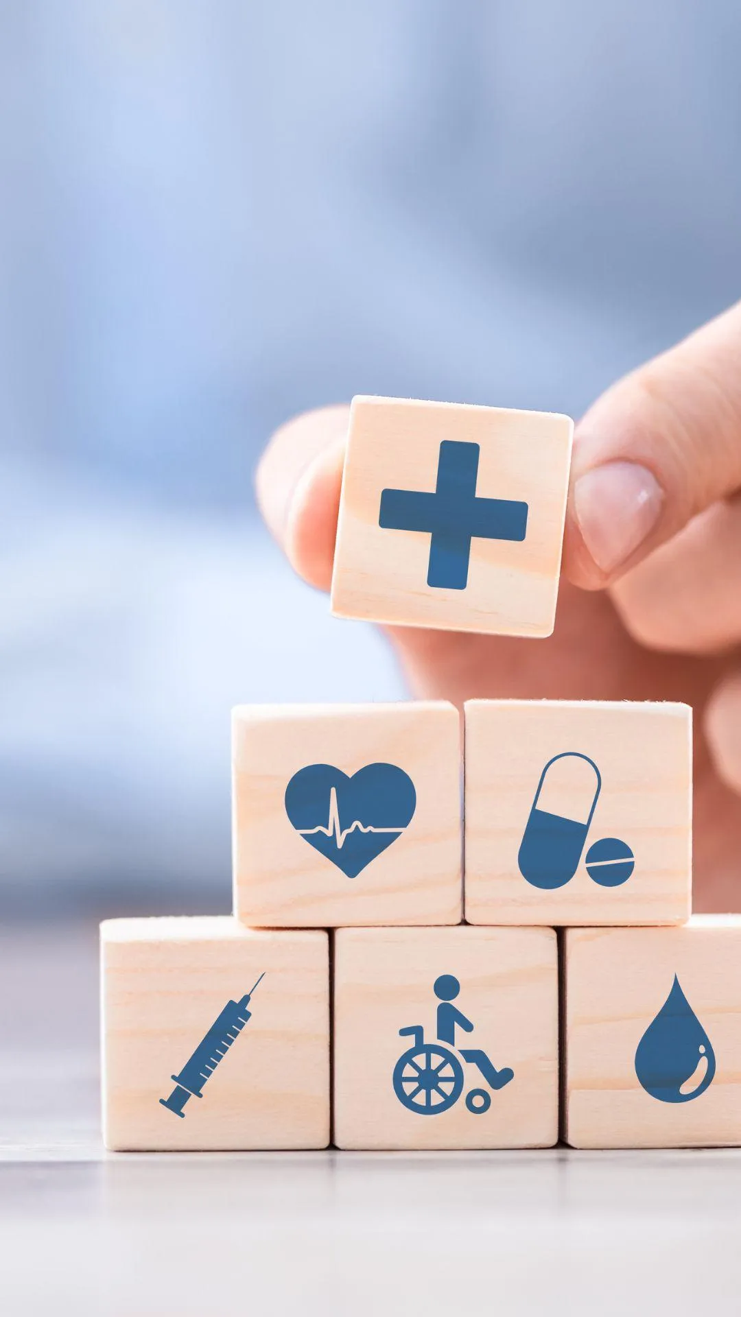 stacking cubes showing stages of health insurance