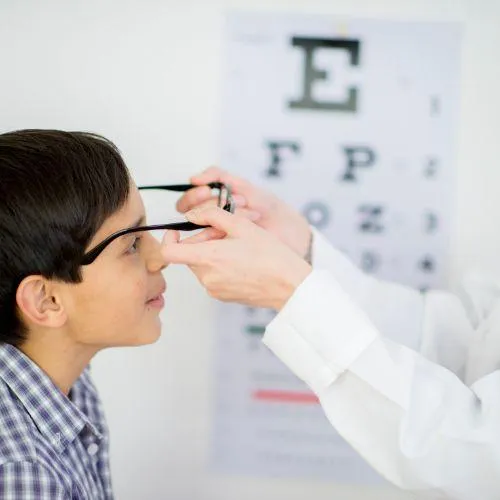 kid getting his eyes checked as part of vision insurance in Des Plaines