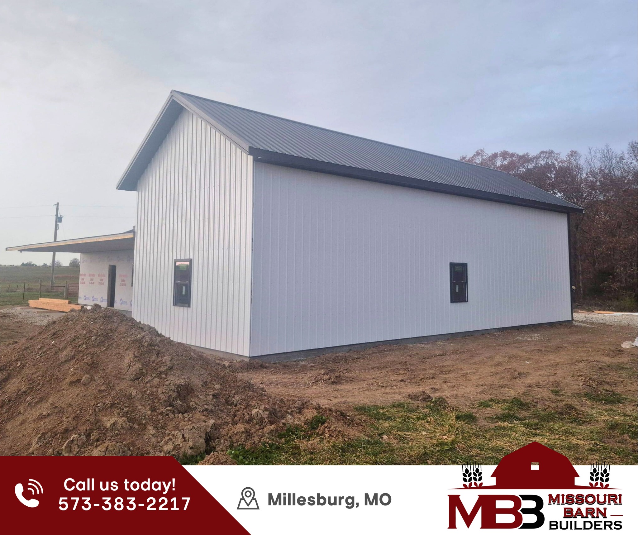 Old wooden barn with open doorways and hay