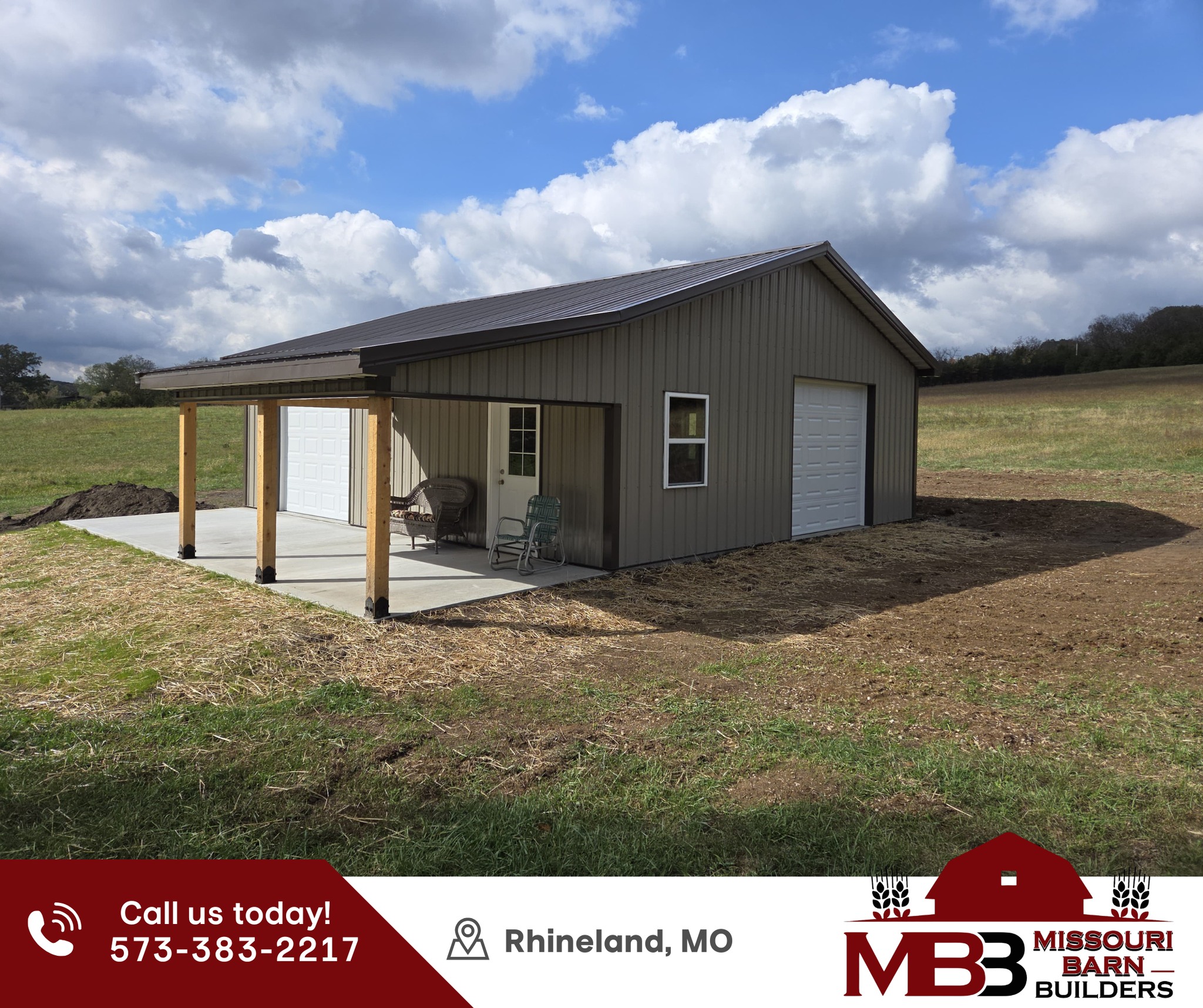 a black garage door with a light on it
