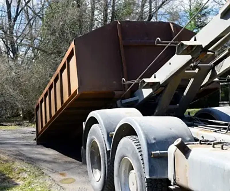 A rugged roll-off dumpster on an active construction jobsite